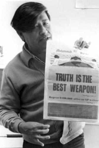 Cesar-Chavez-With-Newspaper
